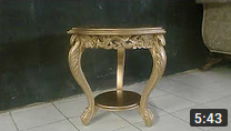 Round coffee table finished in gold paint